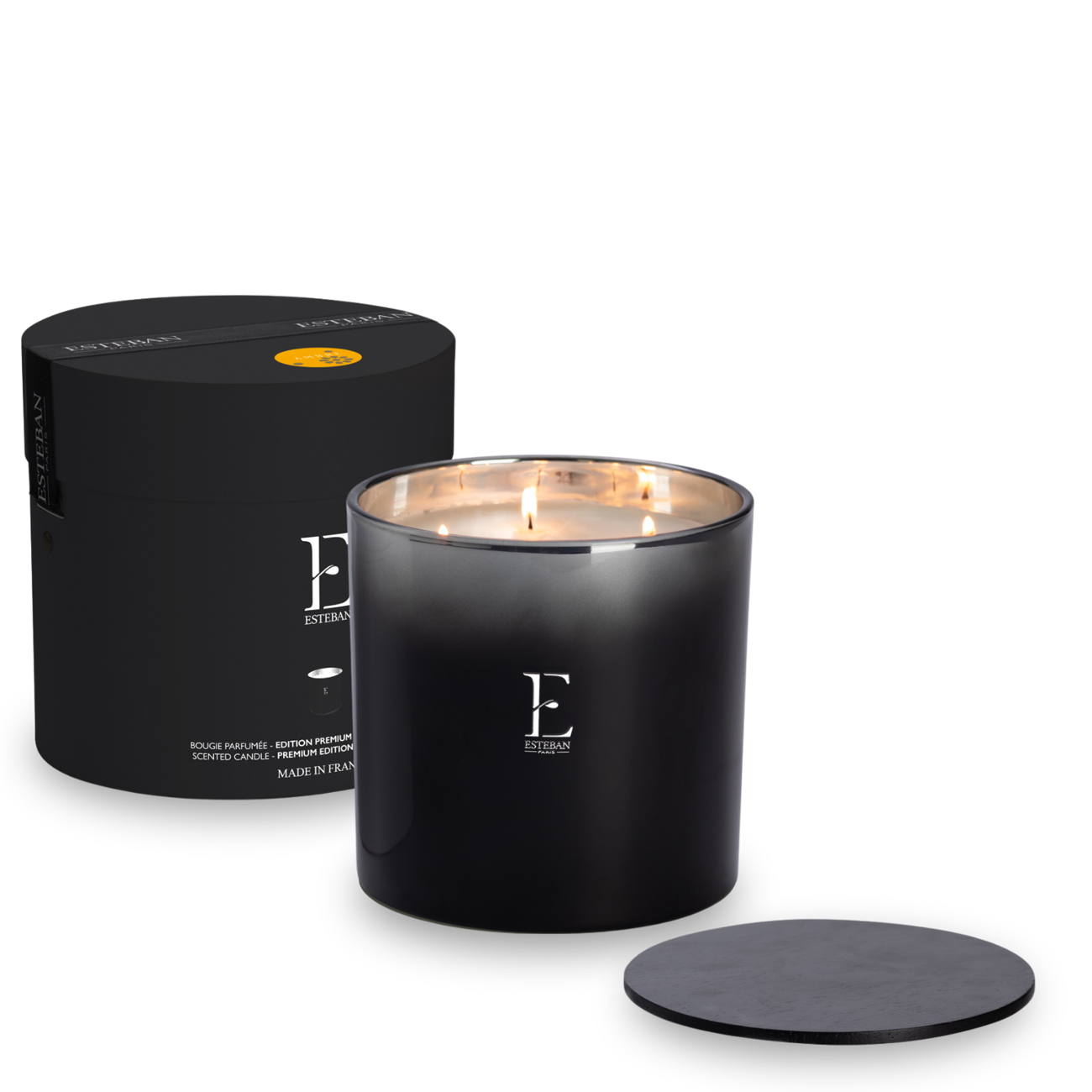 Bougie parfumée Esteban Paris Édition Premium, bougie parfumée grand format en verre noir avec trois mèches, présentée avec son coffret cylindrique noir et son couvercle assorti